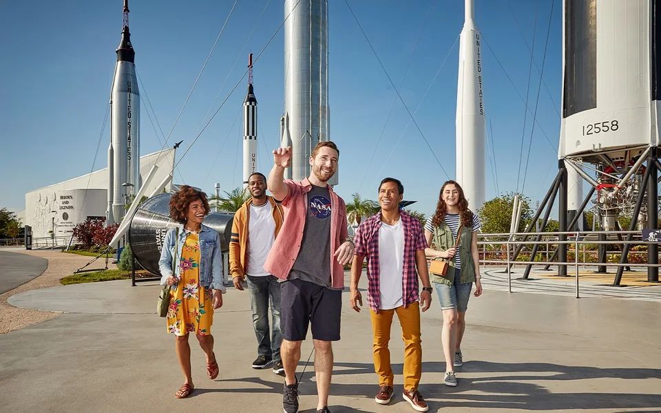 Visitors walking between rockets at Kennedy Space Center