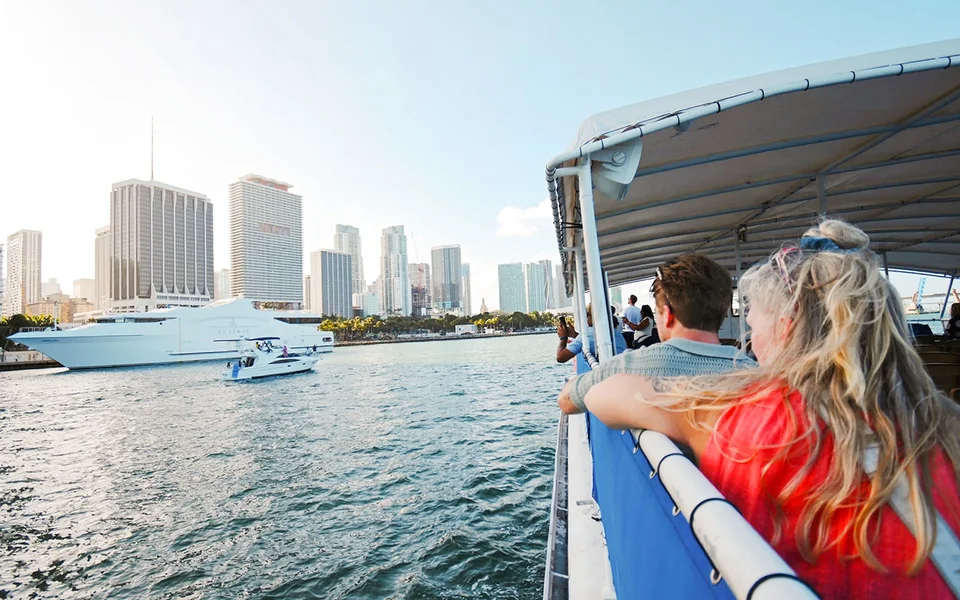 Passengers looking towards the Miami skyline from a sightseeing boat